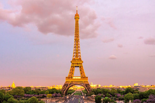 Parisian Splendor: The Eiffel Tower Illuminated at Sunset